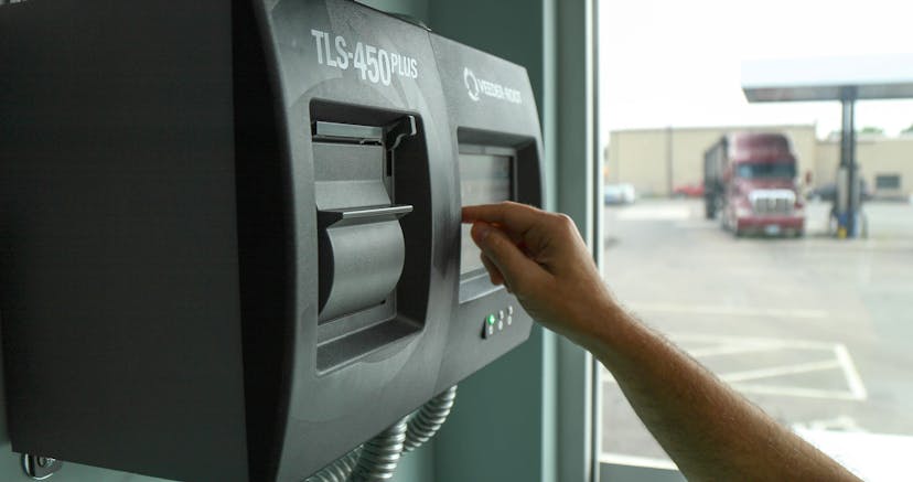 TLS-450 PLUS Application with a hand entering information