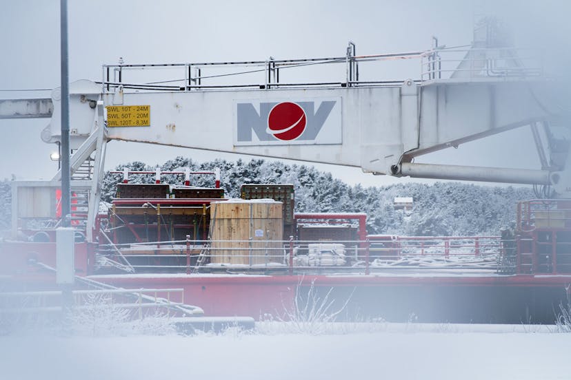 Subsea 7 offshore support vessel crane on a snowy day