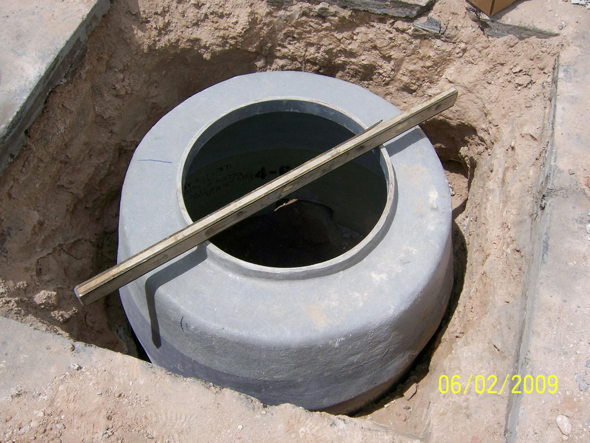 Image of a Dog H ManHole installed in the ground