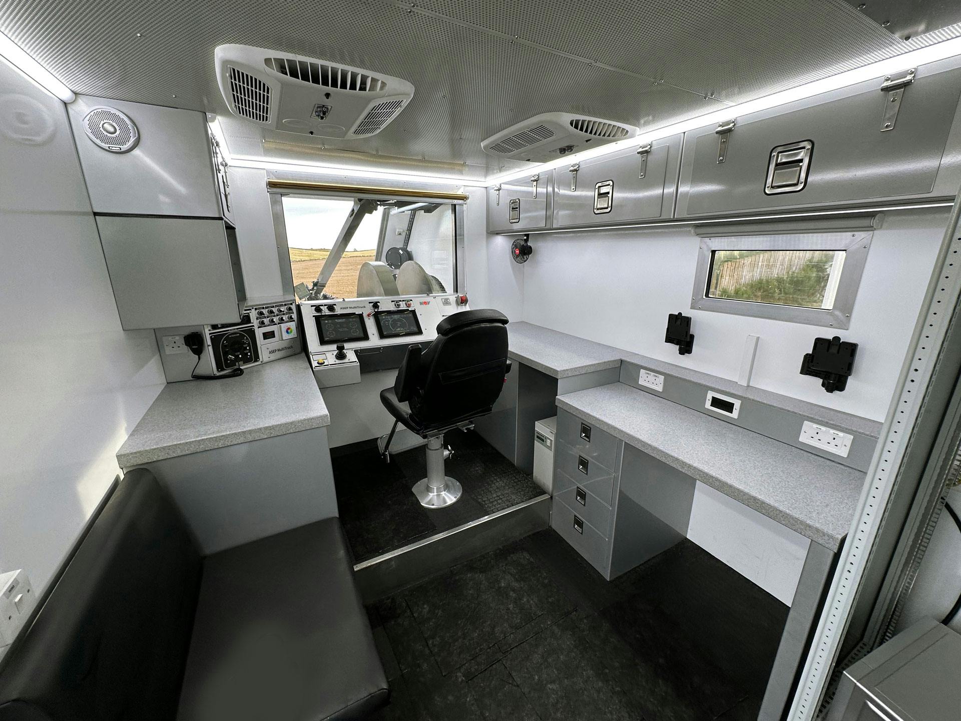 Inside view of a MultiTruck, showing a seat and controls