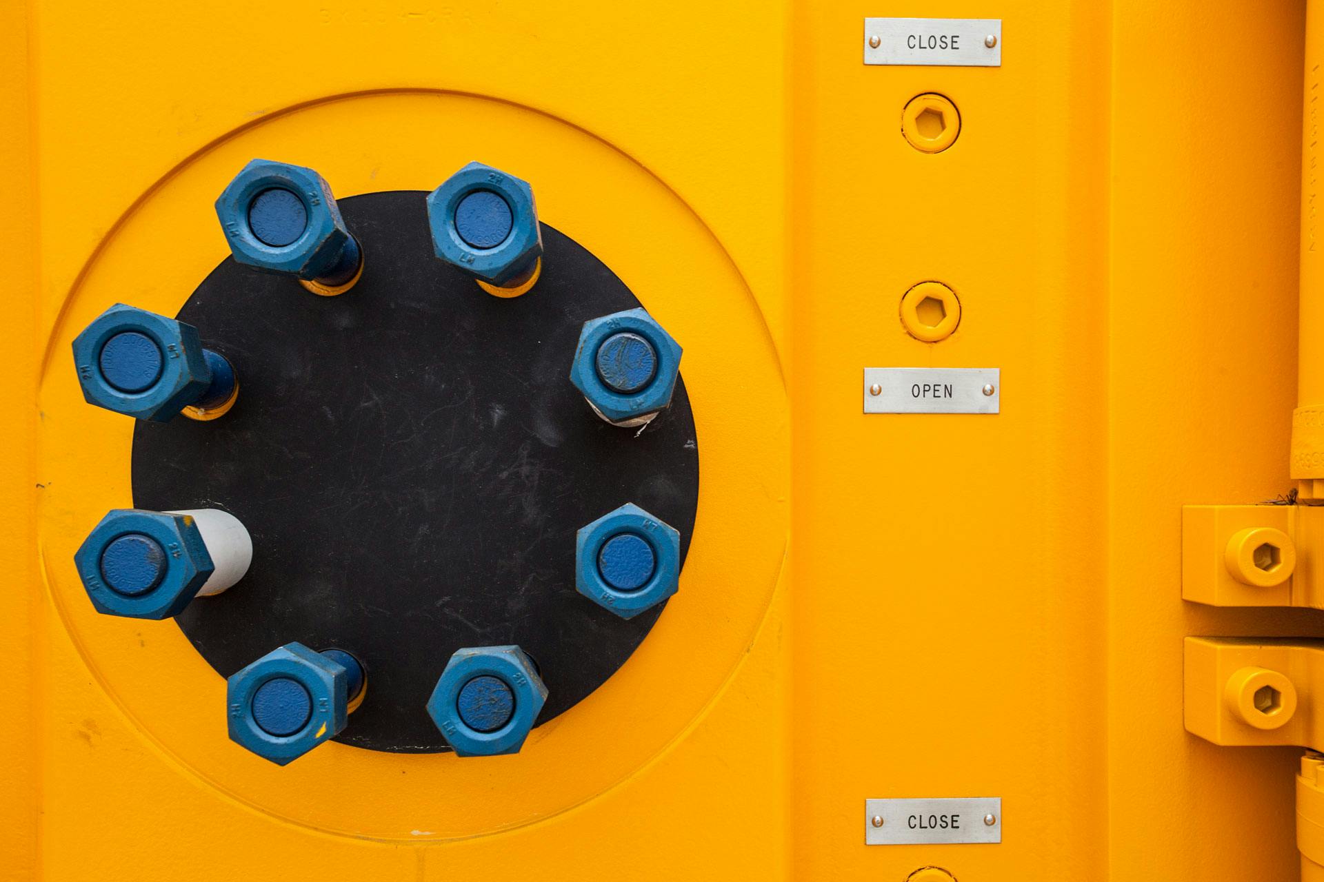 Close up of yellow equipment used for pressure control